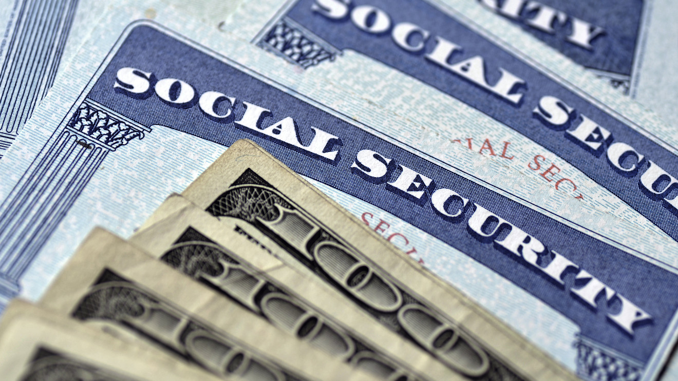 Social security cards and one hundred dollar bills.