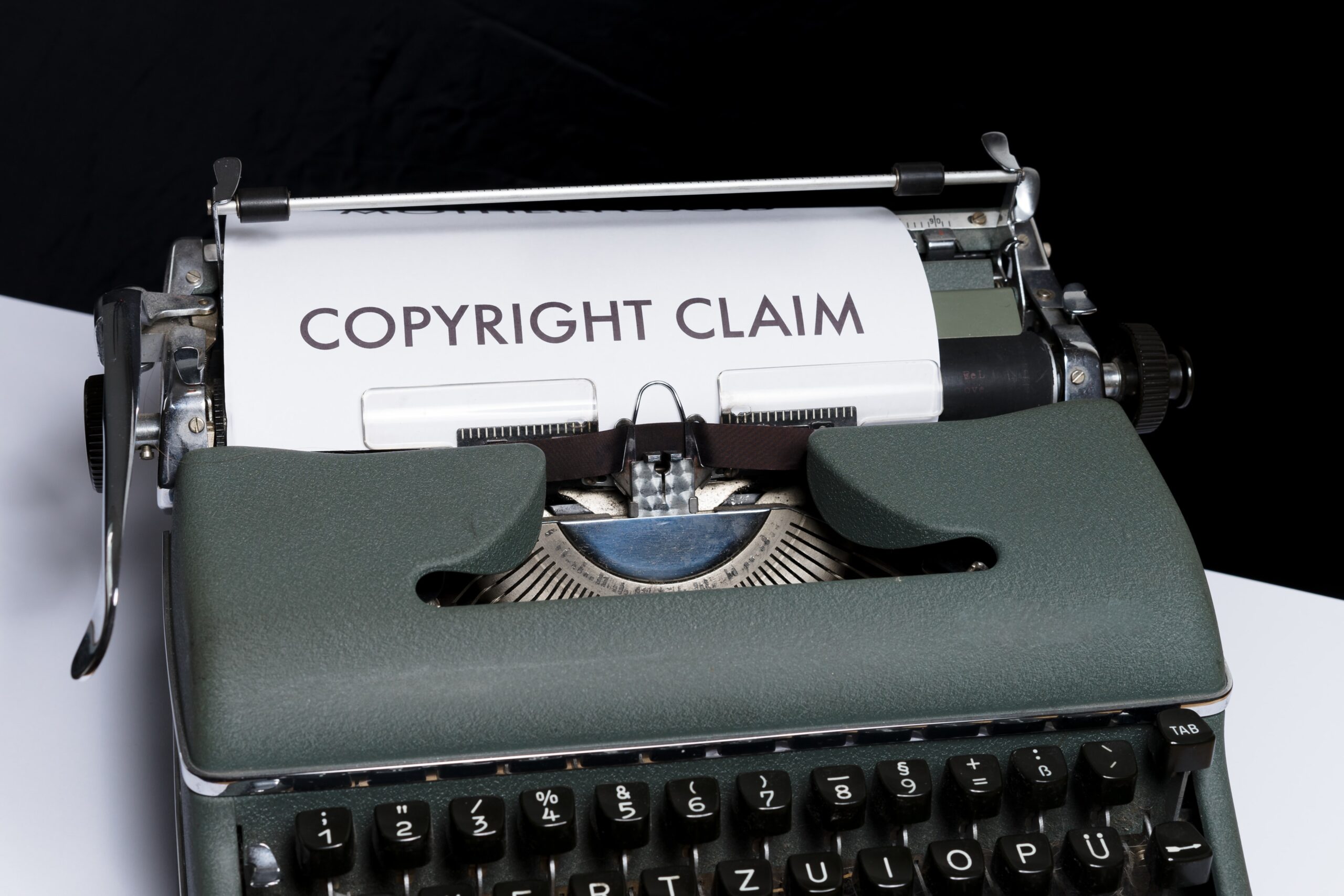 Paper in typewriter with the words copyright claim