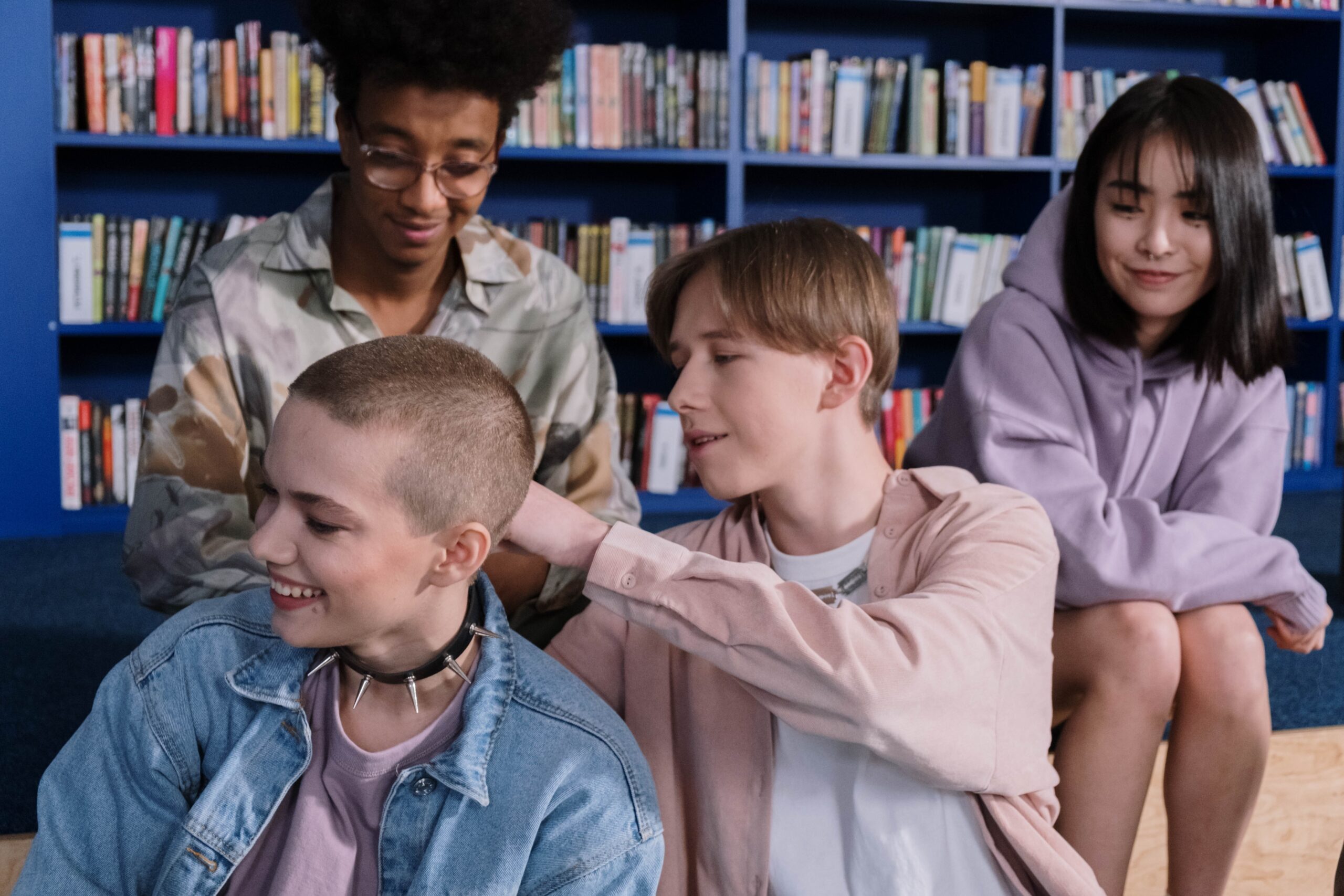 Teens interacting in library setting