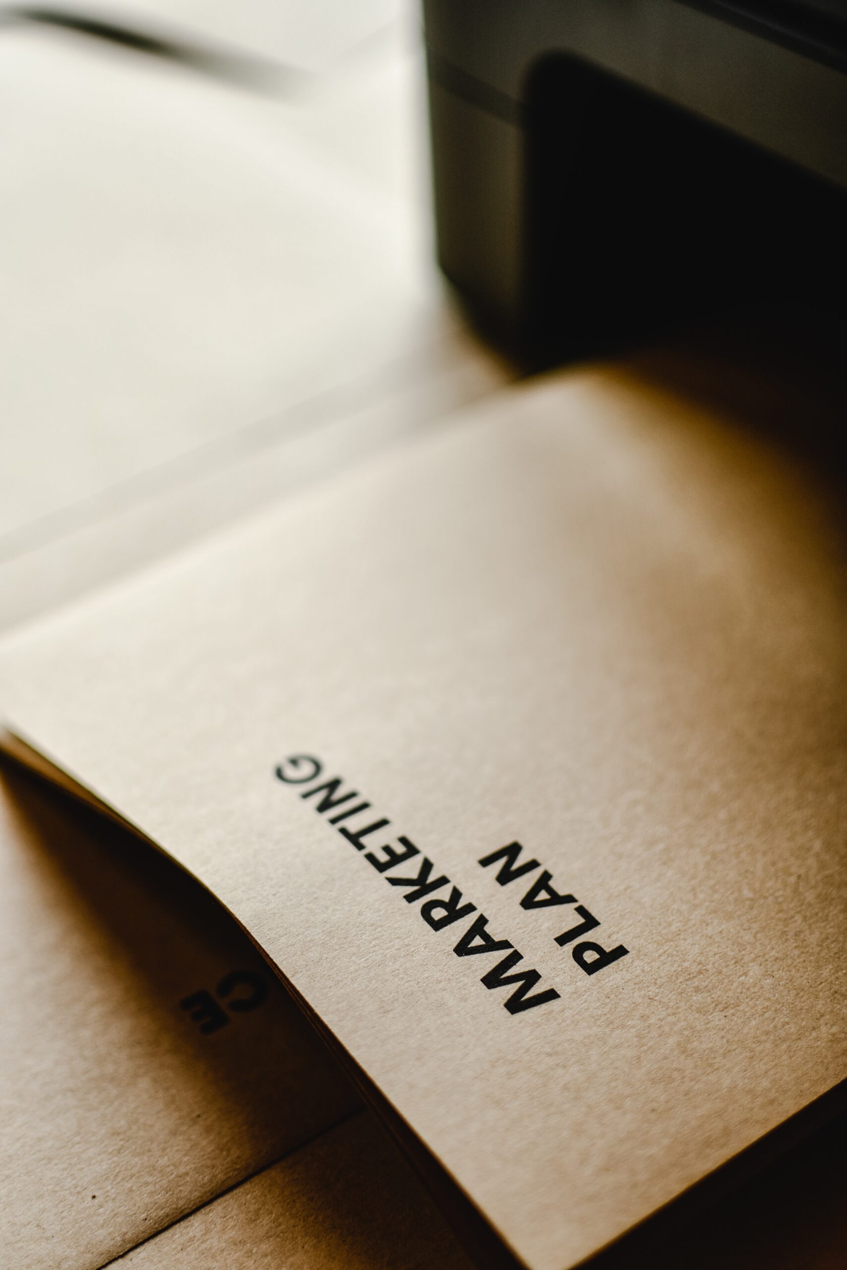 Paper in printer that reads Marketing Plan.