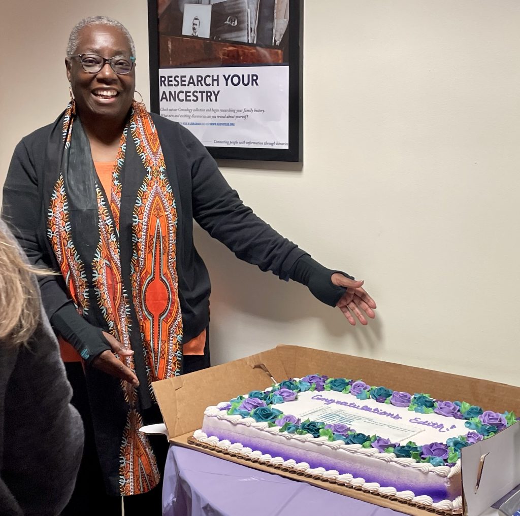 Dr. Edith Beckett at NJSL celebrating her NJAL Technical Services Award from NJLA, with library staff, posing with the cake.