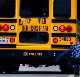 School bus stopped for children getting on the bus